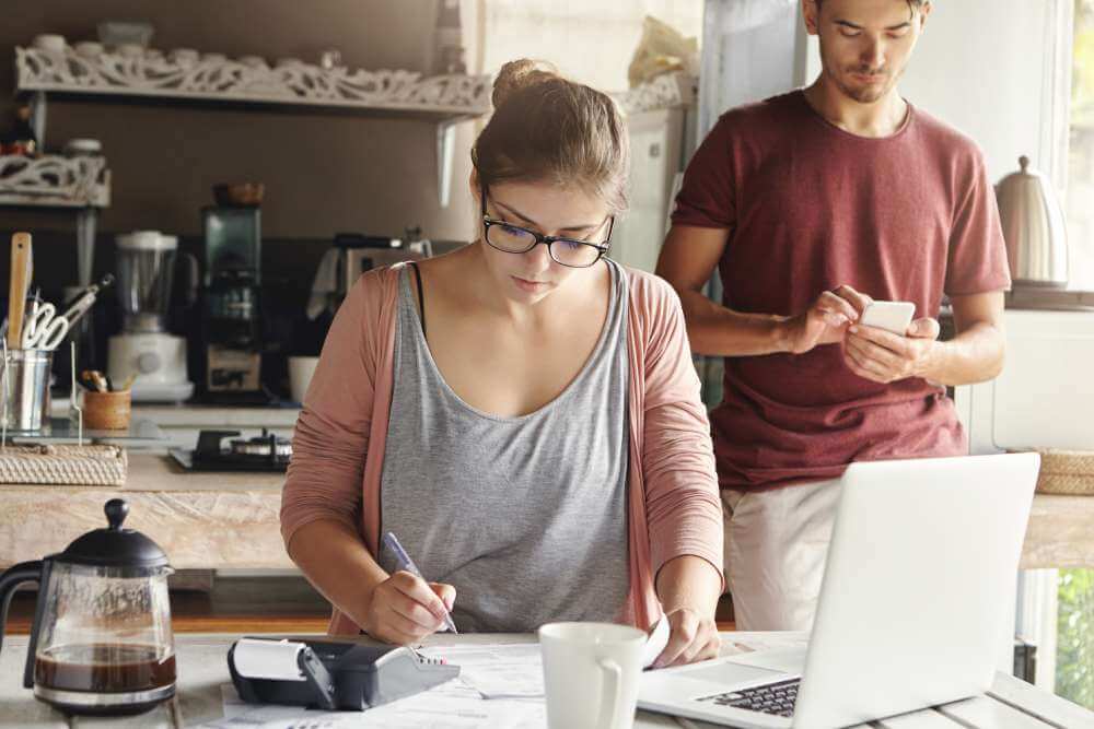 Young Couple calculating Bugdet