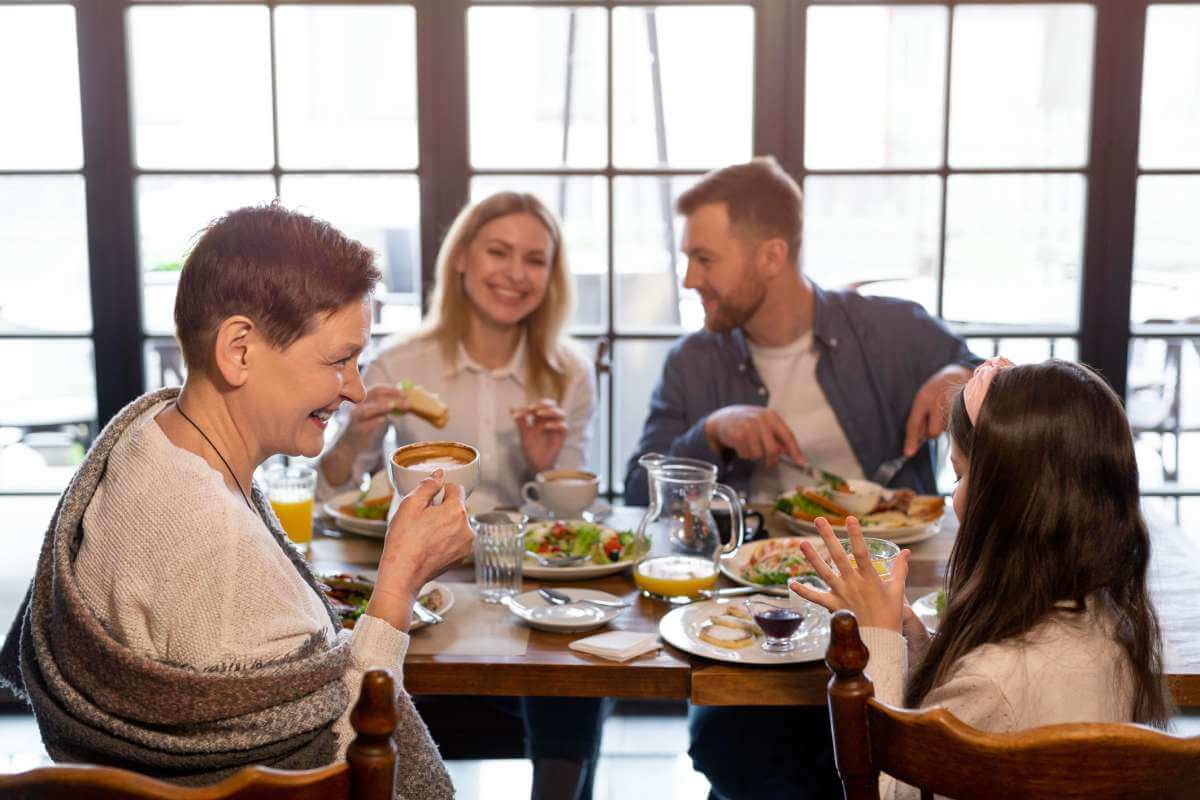 Family hvaing good time at dinner